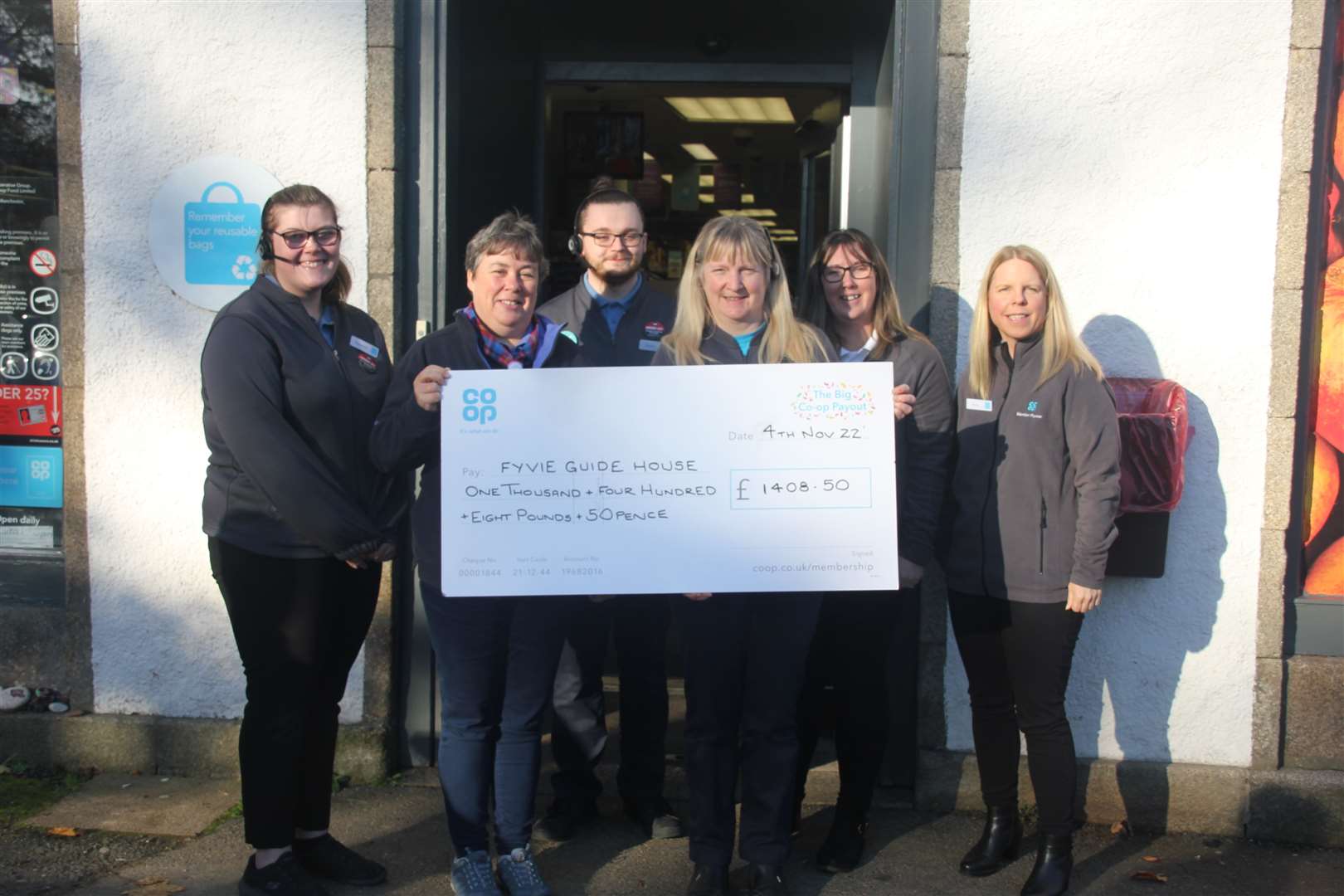 Fyvie Guide House received a cheque from Fyvie Coop staff. Picture: Kirsty Brown