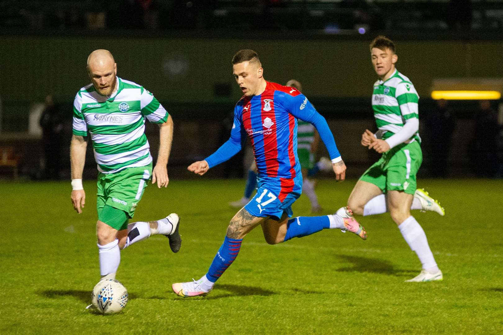 Lewis Mackinnon (left) playing against Caley Thistle when they visited Buckie in the Scottish Cup this year. Picture: Daniel Forsyth