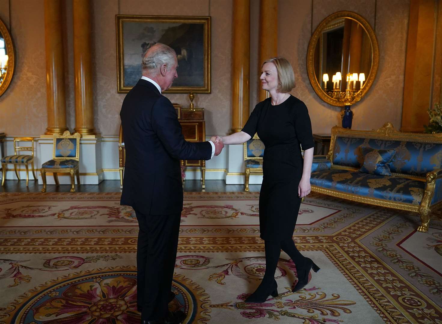 The King shakes hands with Prime Minister Liz Truss during their first audience at Buckingham Palace (Yui Mok/PA)