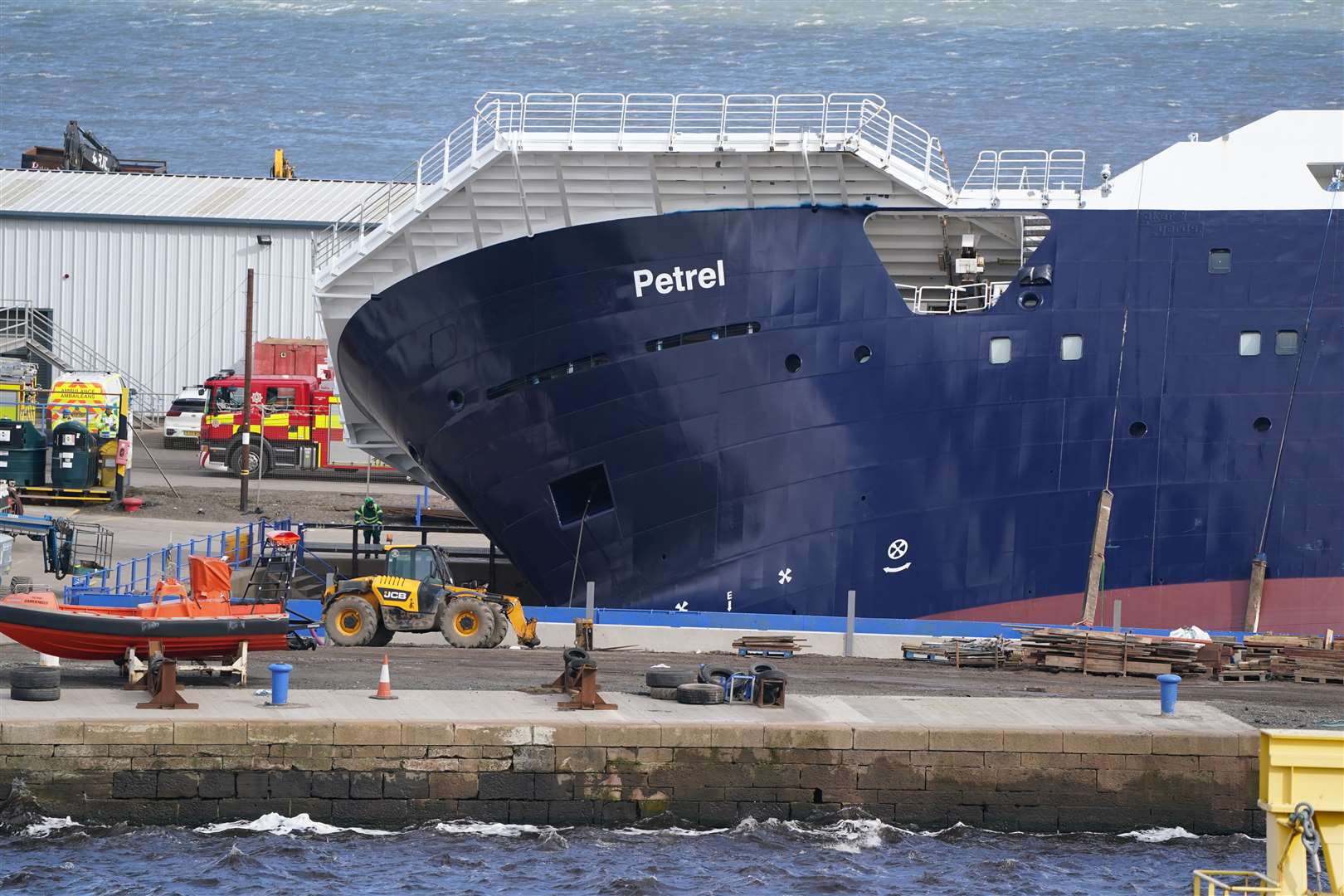 The vessel leaning on its side following the incident at Imperial Dock in Leith (Andrew Milligan/PA)