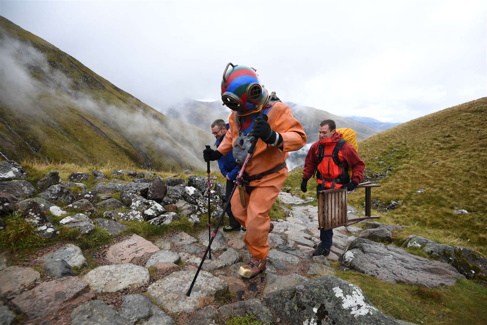 Lloyd Scott is attempting to climb the Three Peaks while wearing a deep-sea diving suit (Joe Giddens/PA)