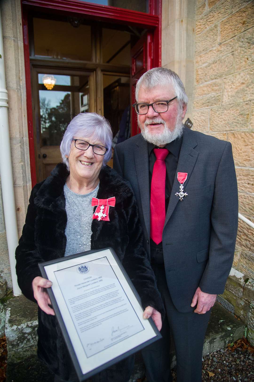 Ronnie and Joyce Loveland, from Mosstodloch, received their MBE medals for Fostering from Lord Lieutenant Seymour Monro and Roddie Burns from Moray Council...Picture: Becky Saunderson..