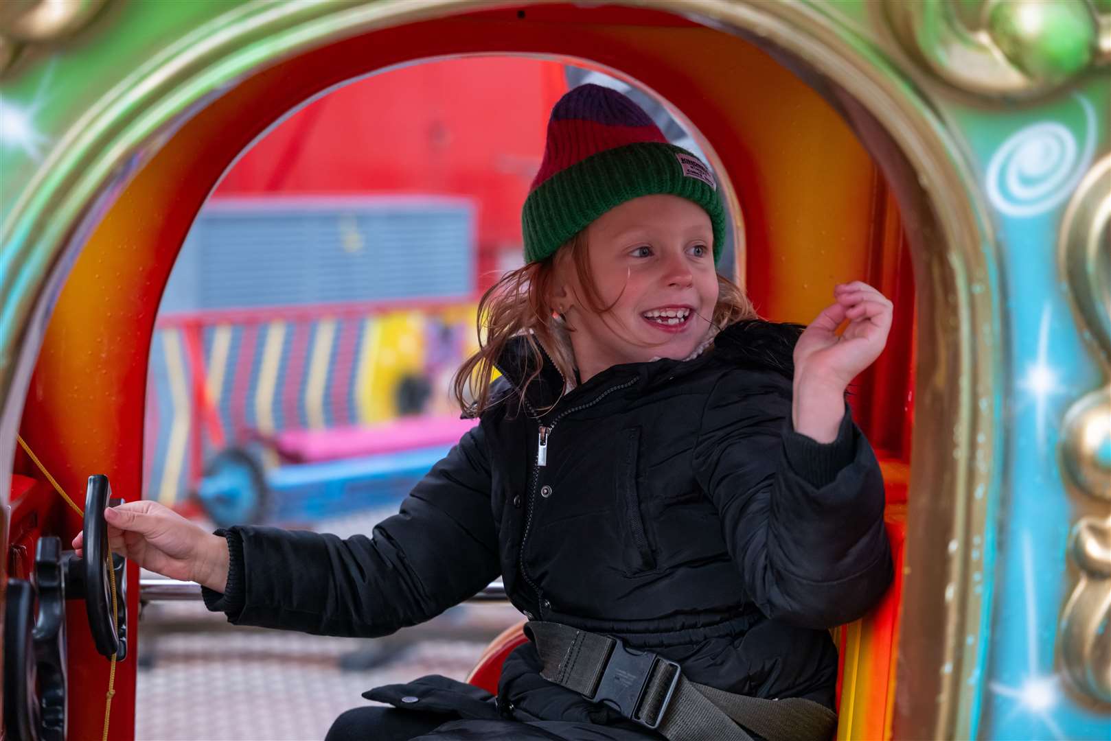 A child enjoying the fairground rides.