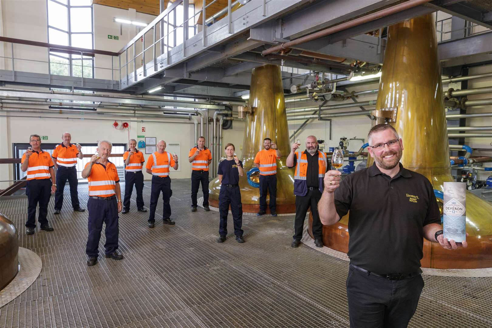 Jamie Winfield with his team of operators at Macduff Distillery. Picture: Ross Johnston