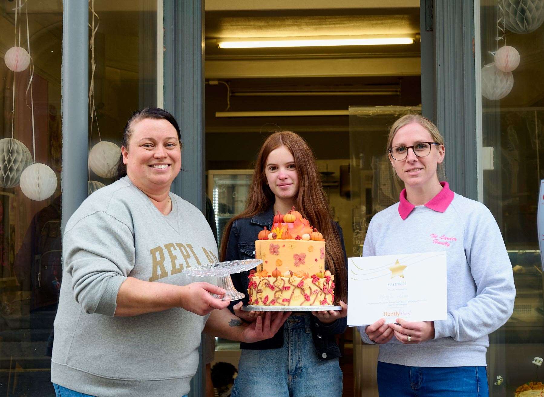 Winner of the senior cake contest Maggie Milne with Laura Gardner proprietor of the Larder, left and Karen Leggat one of The Larder team.