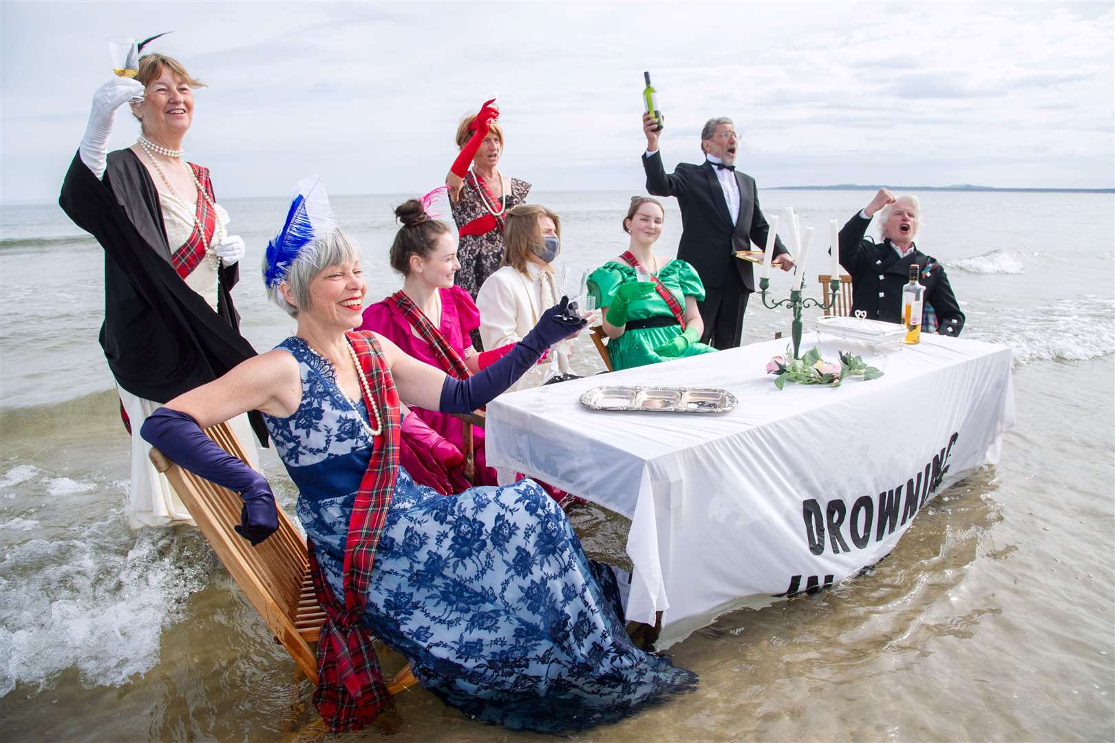 The Extinction Rebellion Forres group hold a dinner party demonstration in the waters at Findhorn ahead of the G7 Summit in Cornwall...Picture: Daniel Forsyth..
