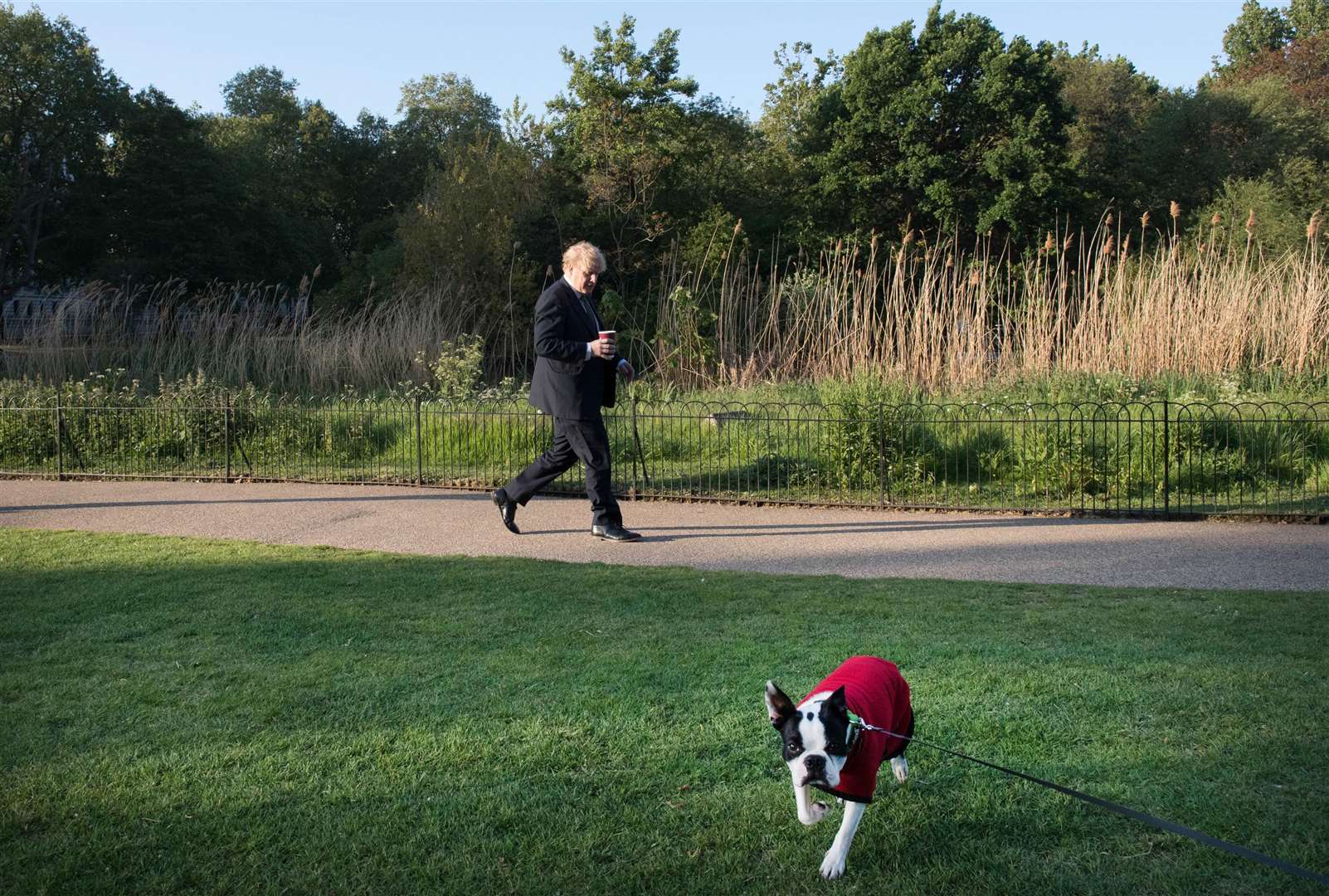 Prime Mr Johnson taking a morning walk in St James’s Park before returning to Downing Street in May. After his stay in hospital, the Prime Minister said he had lost weight and improved his fitness (Stefan Rousseau/PA)