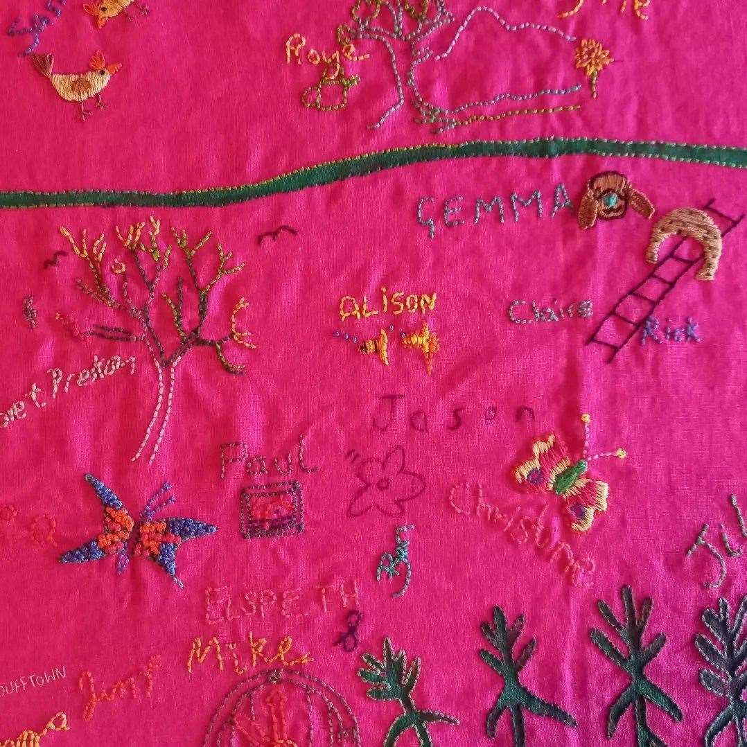 Claudia carried a bespoke printed pink tablecloth and encouraged those she spoke with to sign it and add drawings which she has since embroidered into the fabric.