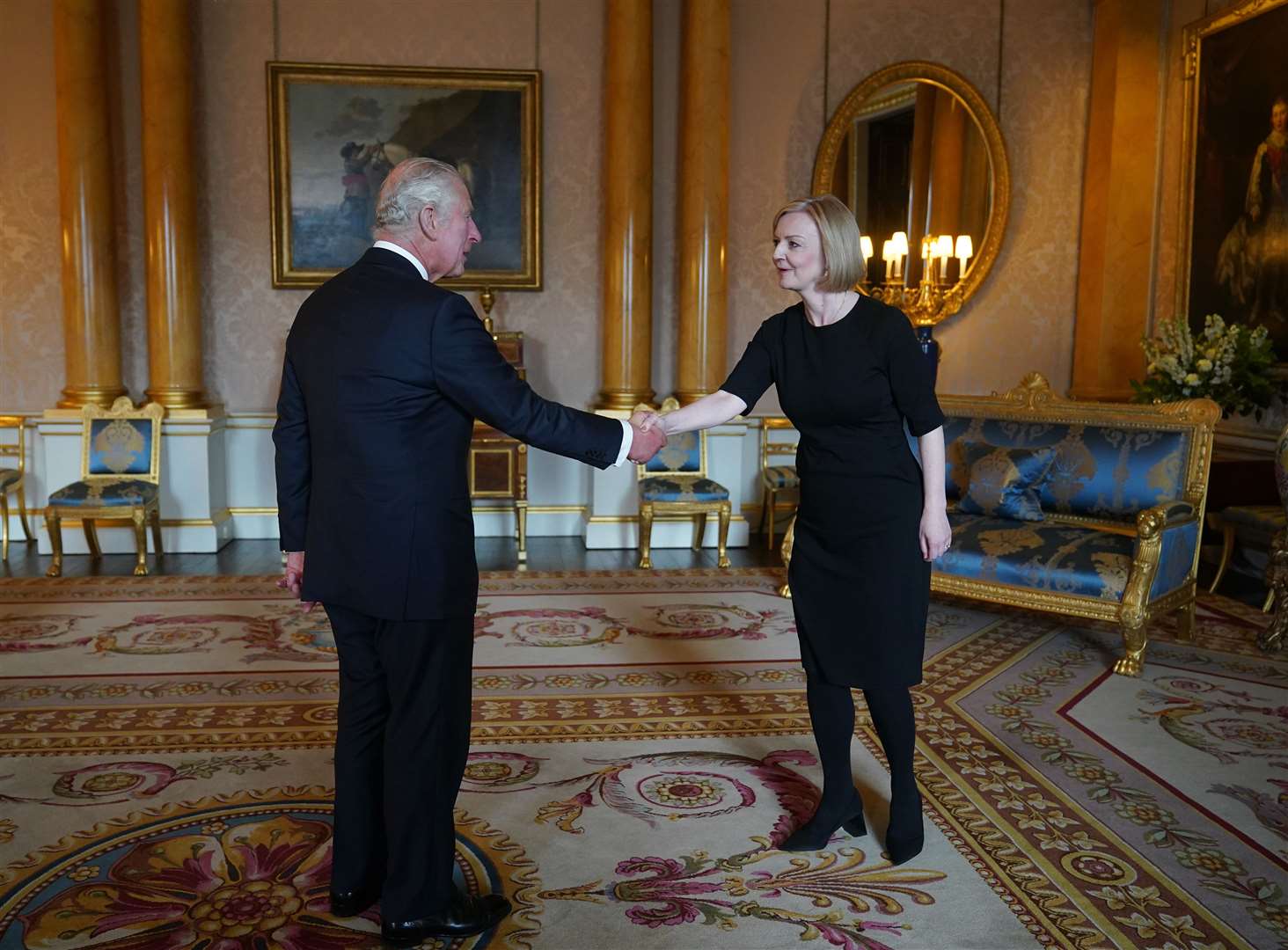 The King shakes hands with Prime Minister Liz Truss (Yui Mok/PA)