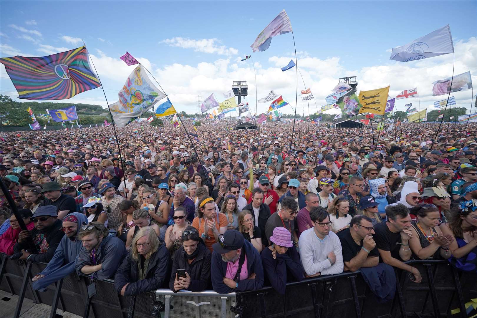 The crowd listens to climate activist Greta Thunberg speaking on the Pyramid Stage (Yui Mok/PA)
