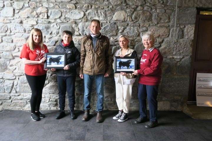 Presenting donations to Gemma Cameron (left) and Ruth Skinner (right) were Yasmin's family William, Sandy and Sophie.