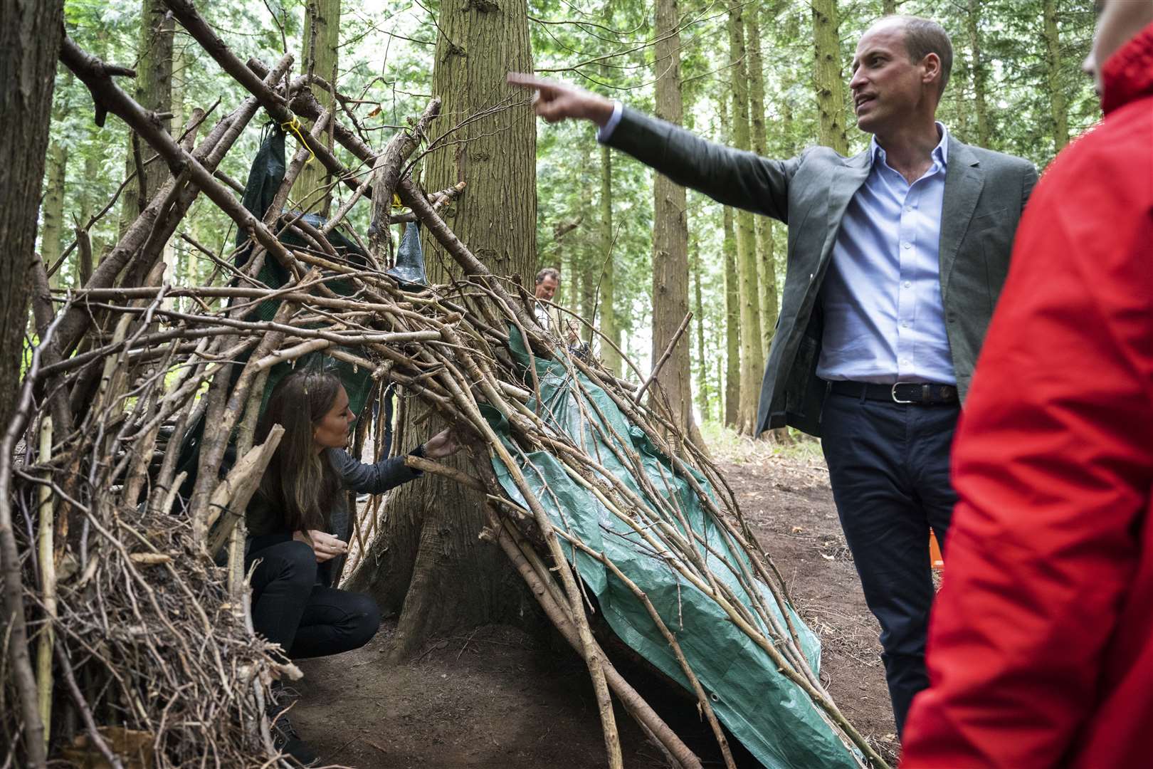 The prince and princess inspected a den made by pupils during their woodland class (David Rose/The Daily Telegraph/PA)