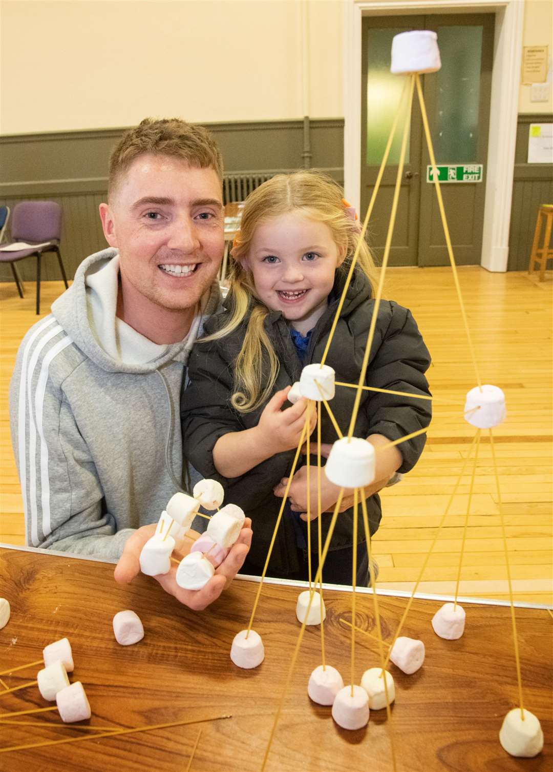 Lewis Telfer with daughter Rose and their tower. Picture: Daniel Forsyth