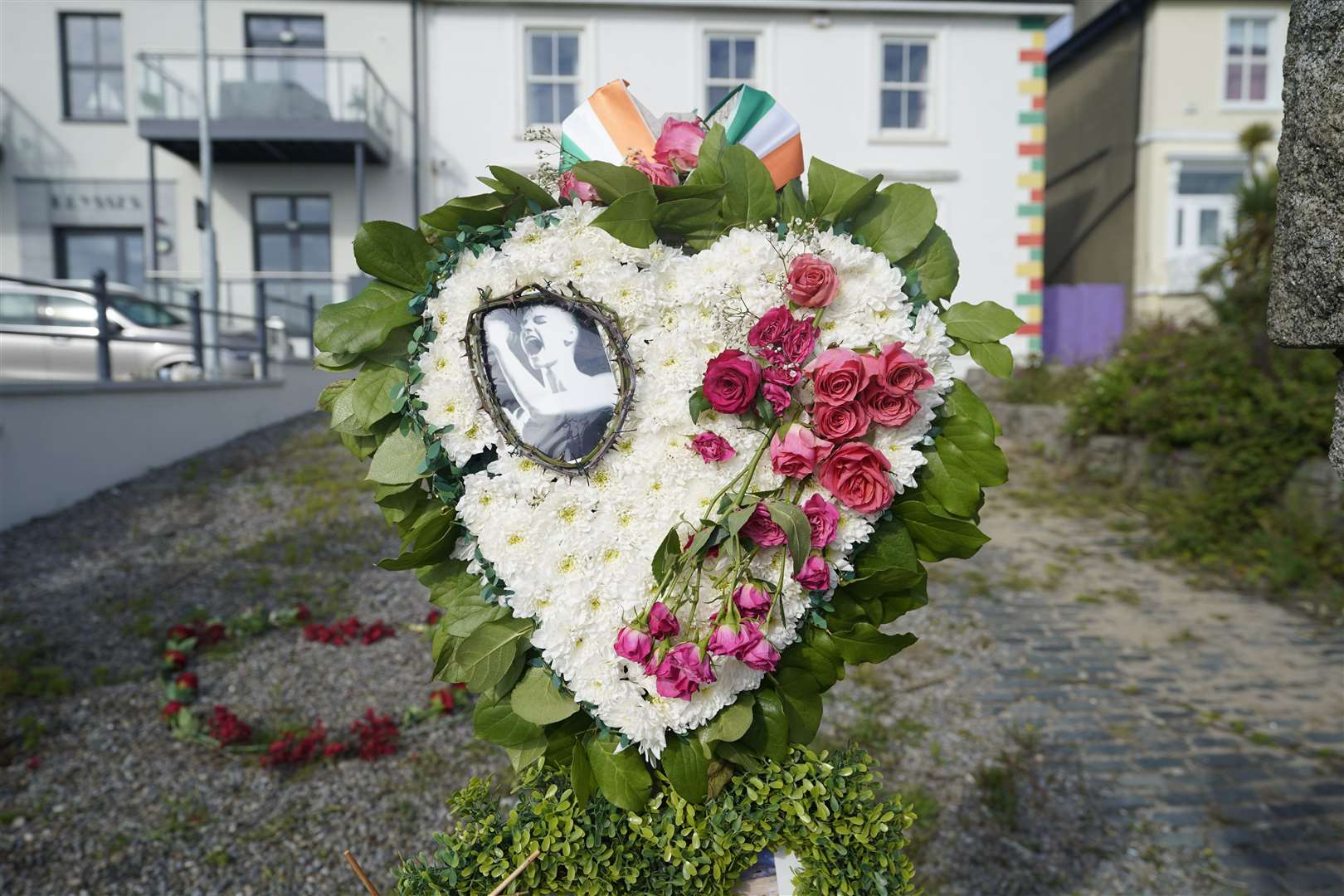 Floral tributes left outside her former home in honour of Sinead O’Connor (Niall Carson/PA)
