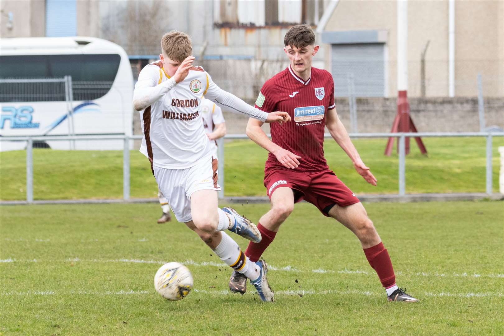 Forres front man Ethan Cairns takes the ball away from Keith defender Murray Addison. Picture: Beth Taylor.