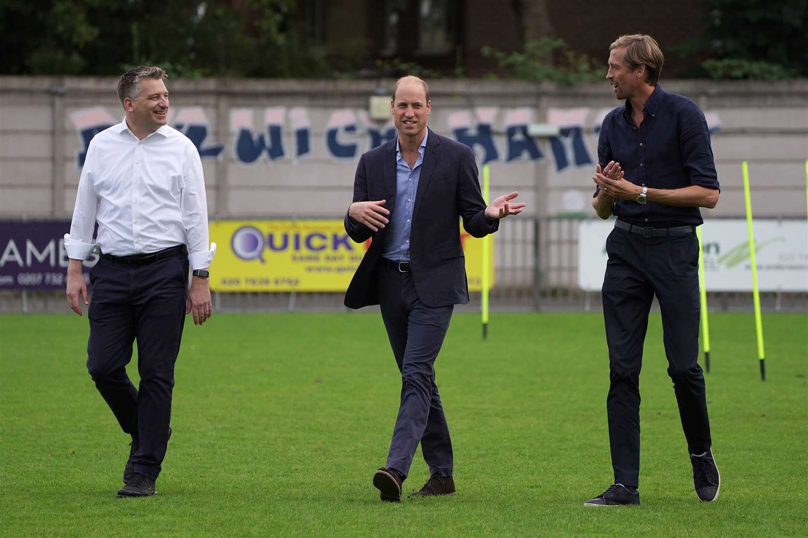 The Duke of Cambridge (centre) with Ben Clasper, chairman of Dulwich Hamlet Football Club (left) and Peter Crouch during his visit to the London club (Kirsty O’Connor/PA)