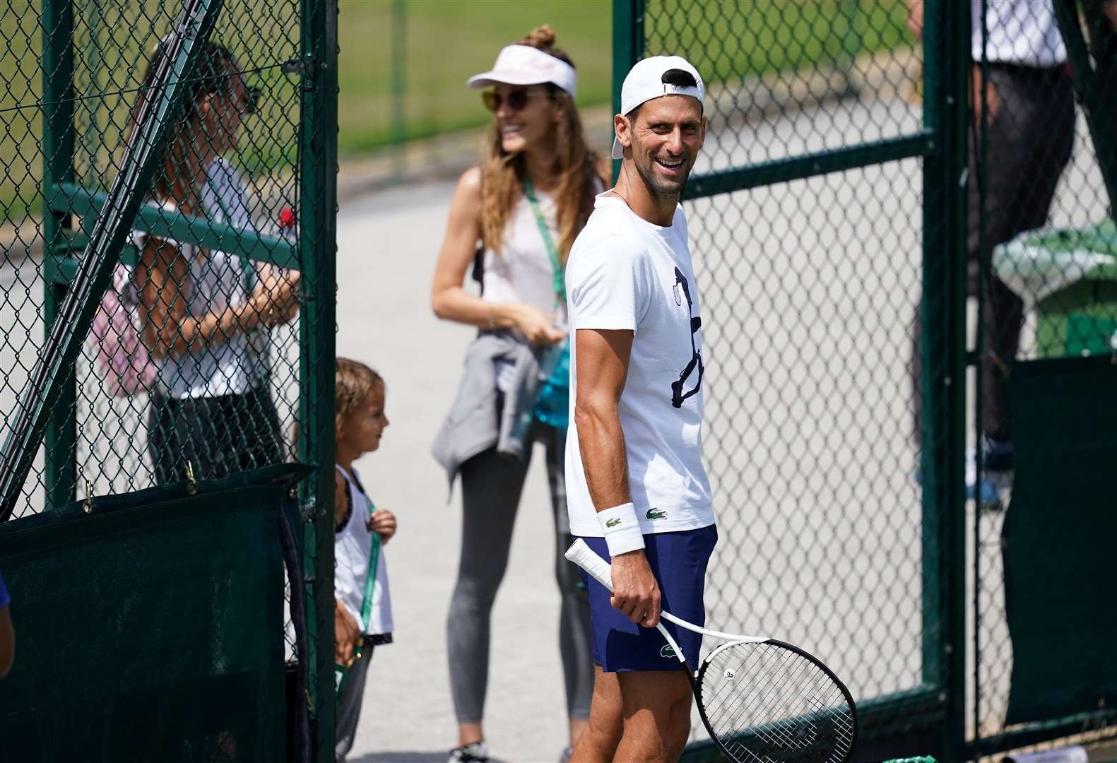 Novak Djokovic with wife during his practice session (John Walton/PA)