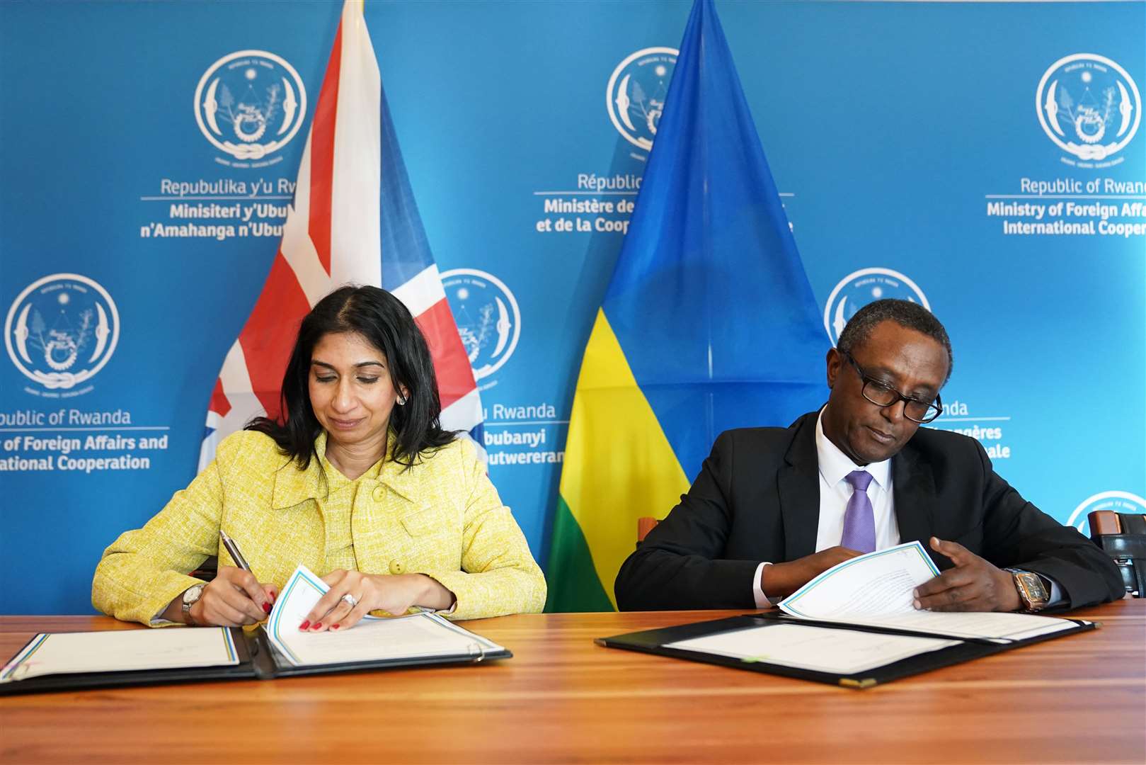 Home Secretary Suella Braverman and Rwandan minister for foreign affairs Vincent Biruta sign an enhanced partnership deal in Kigali (Stefan Rousseau/PA)