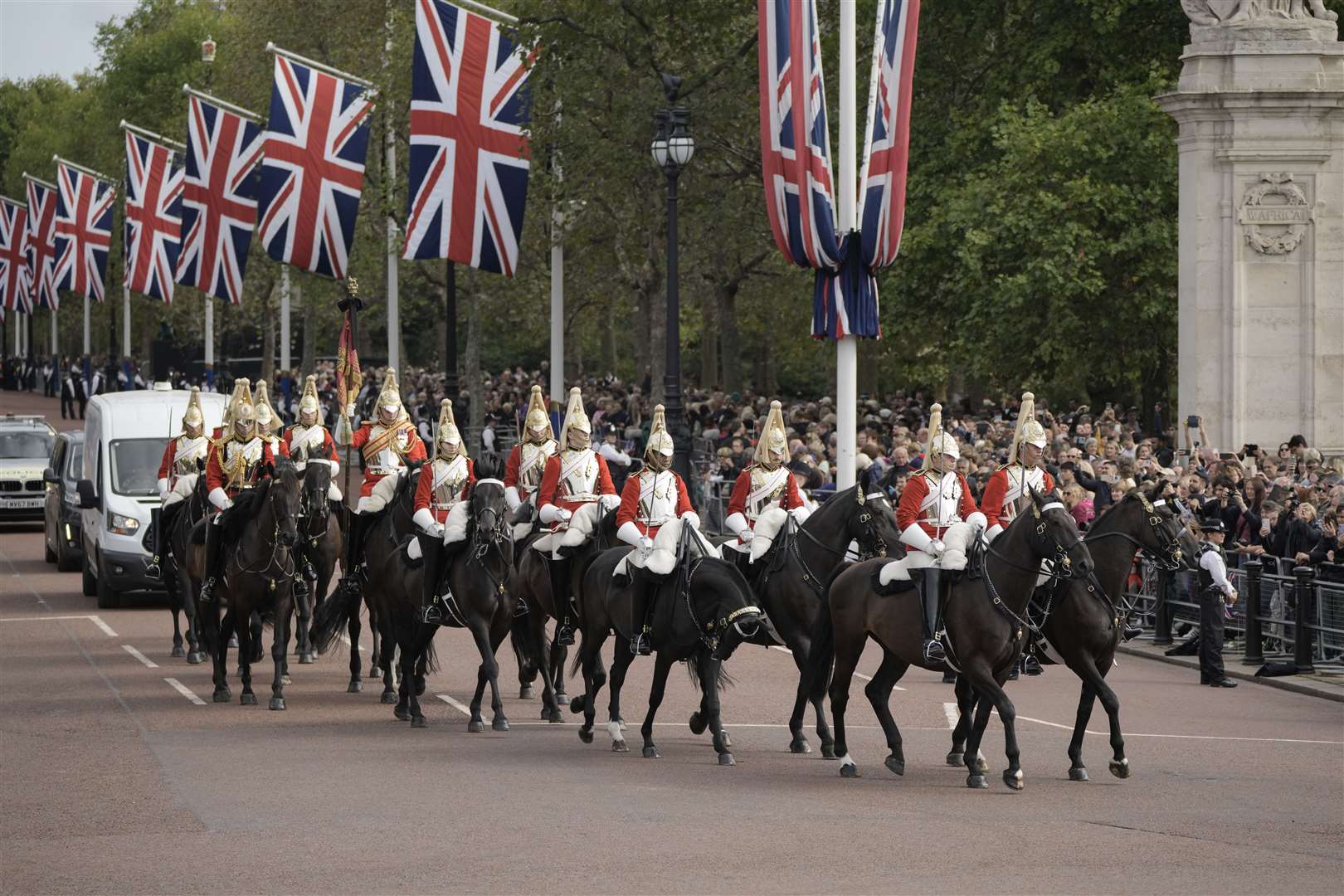 Mounted guards head down The Mall towards Buckingham Palace ahead of the procession (Vadim Ghirda/PA)