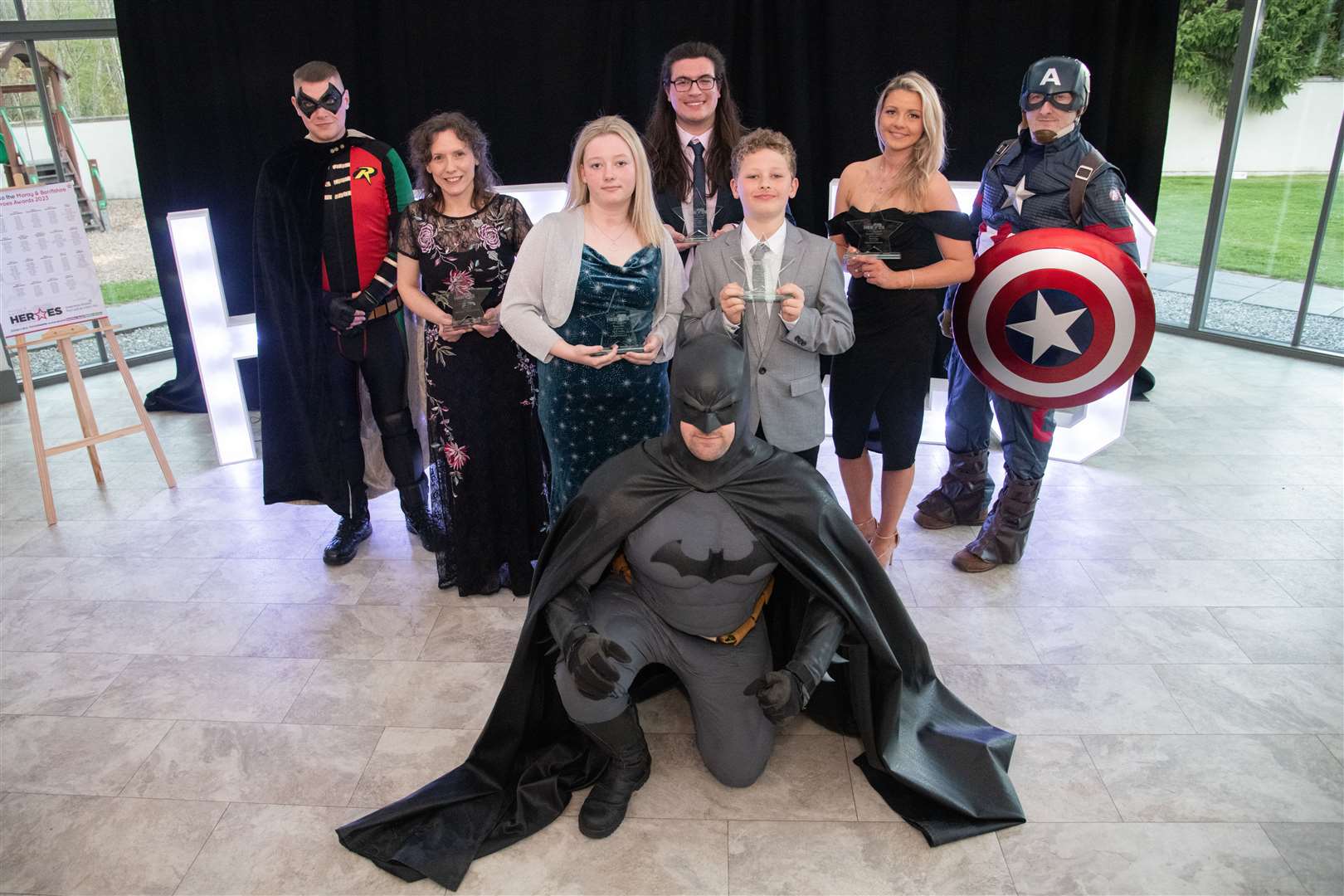 Award winners with the superheroes. Picture: Daniel Forsyth