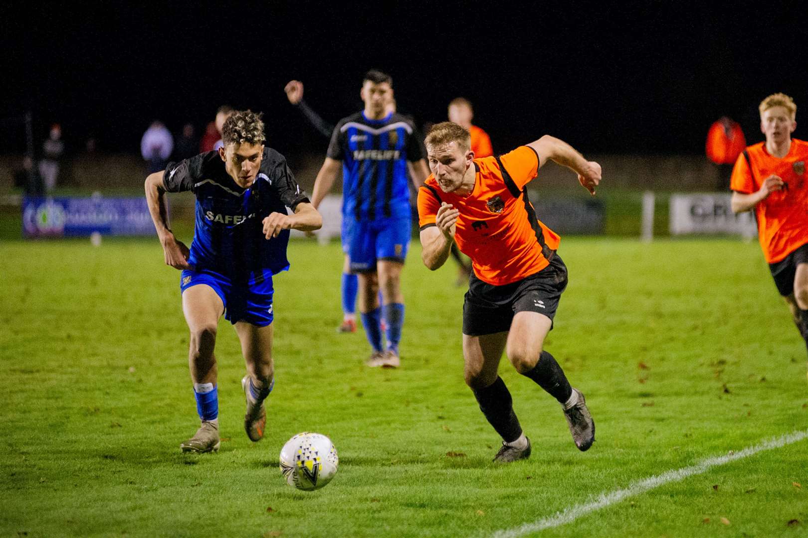 Huntly's Rhys Thomas and Rothes' Gary Kerr chases down the ball...Rothes FC (1) vs Huntly FC (0) - Highland Football League - Mackessack Park , Rothes 28/11/2020...Picture: Daniel Forsyth..