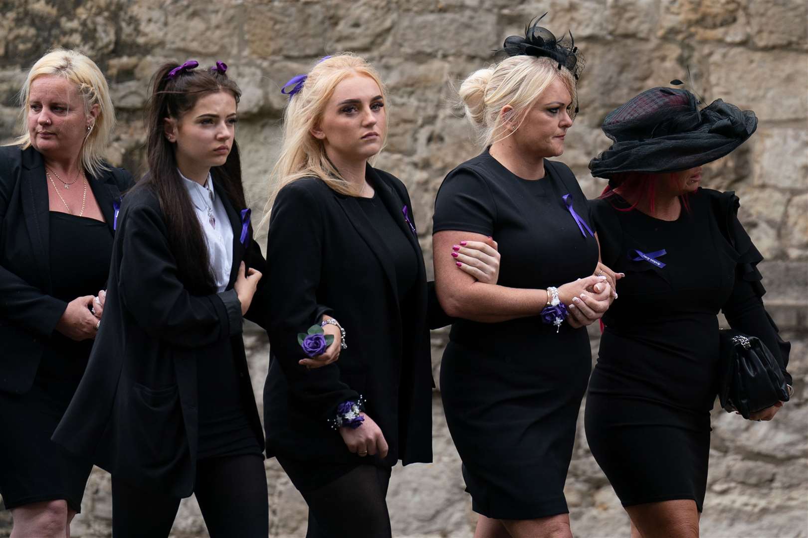 Hollie Dance (second right) follows as the coffin is taken from St Mary’s Church (Joe Giddens/ PA)