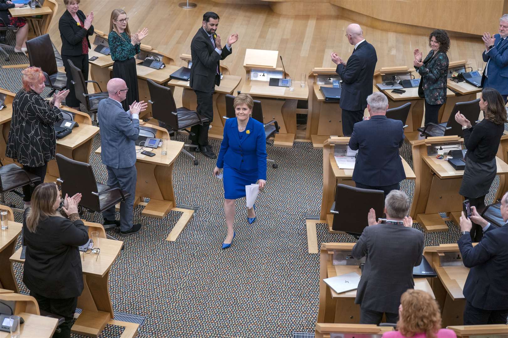 Nicola Sturgeon received a standing ovation as she left the Holyrood chamber following her last session of First Minister’s Questions (Jane Barlow/PA)
