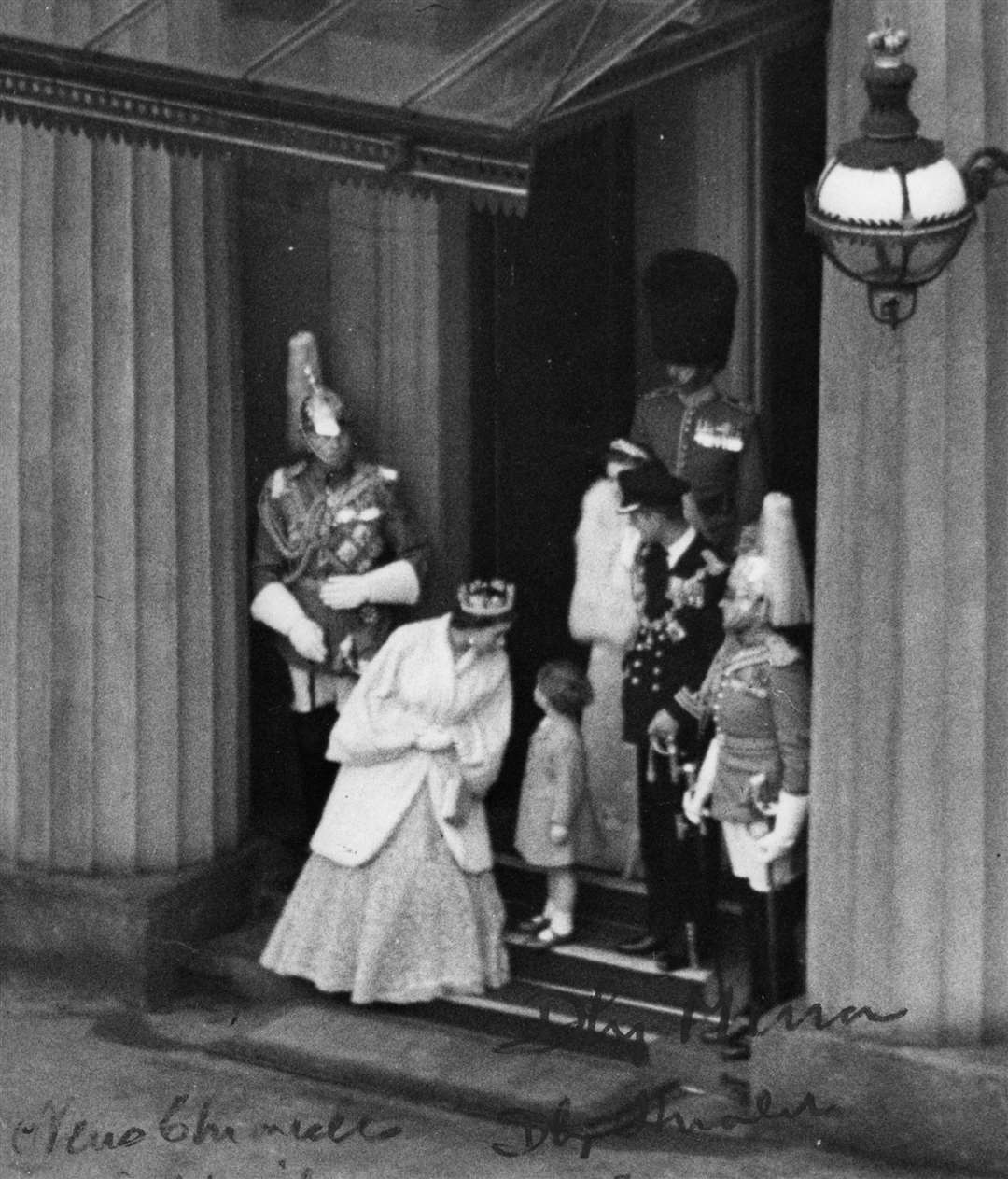 The Queen bends for a private word with Prince Charles in 1952 (PA)