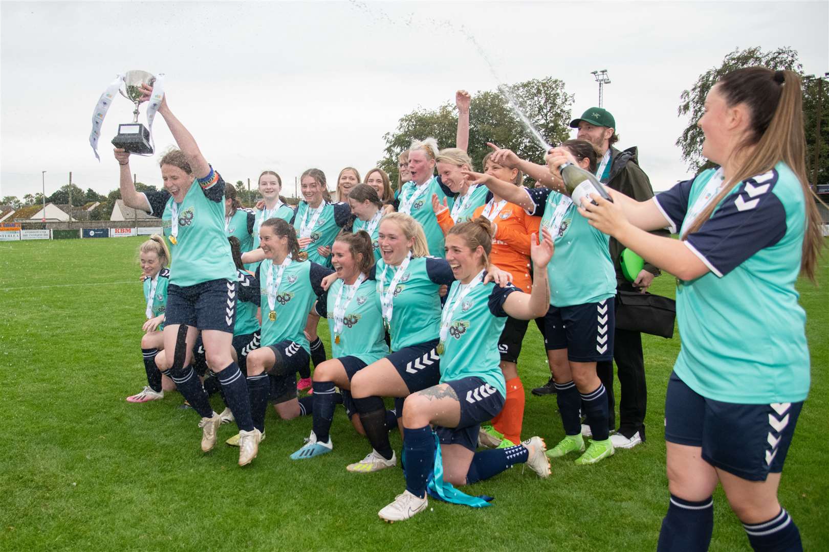It's time to pop the cork on the champagne after claiming the double double. Picture: Daniel Forsyth