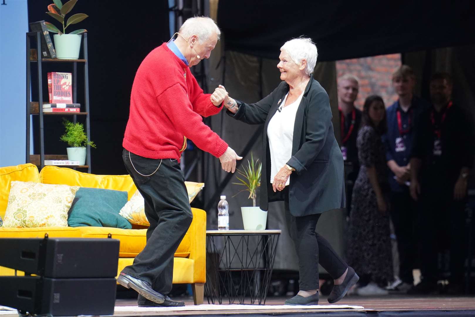 Dame Judi Dench is greeted by Gyles Brandreth at the festival (Jonathan Brady/PA)