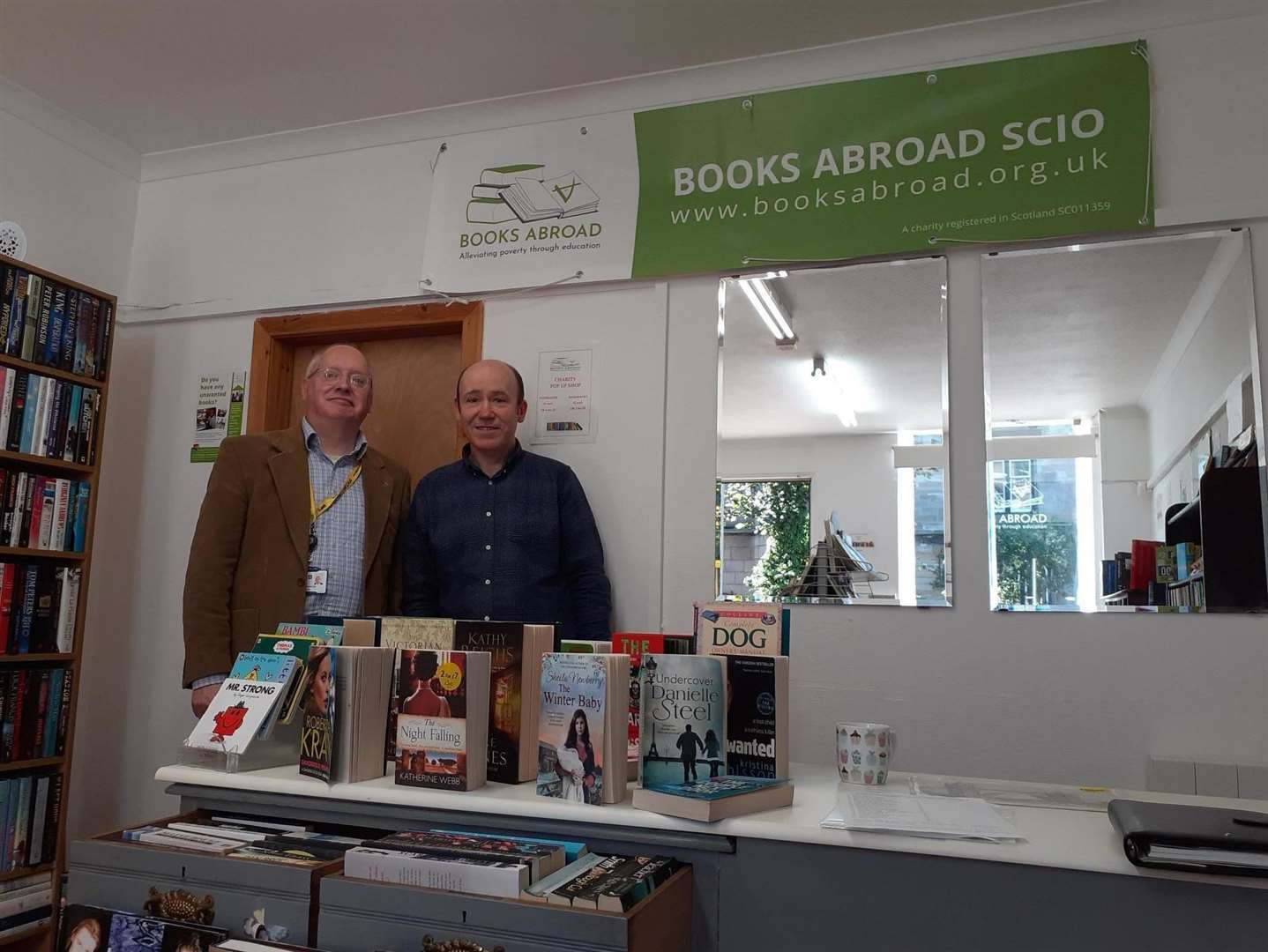 Books Abroad trustee Gary McGregor (right) and councillor Glen Reynolds at the charity's new base in Banff.
