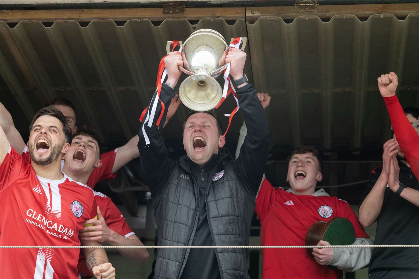 Brechin's Andy Kirk lifting the trophy. ..Buckie Thistle F.C. v Brechin City F.C. Highland League Final at Victoria Park. ..Picture: Beth Taylor.