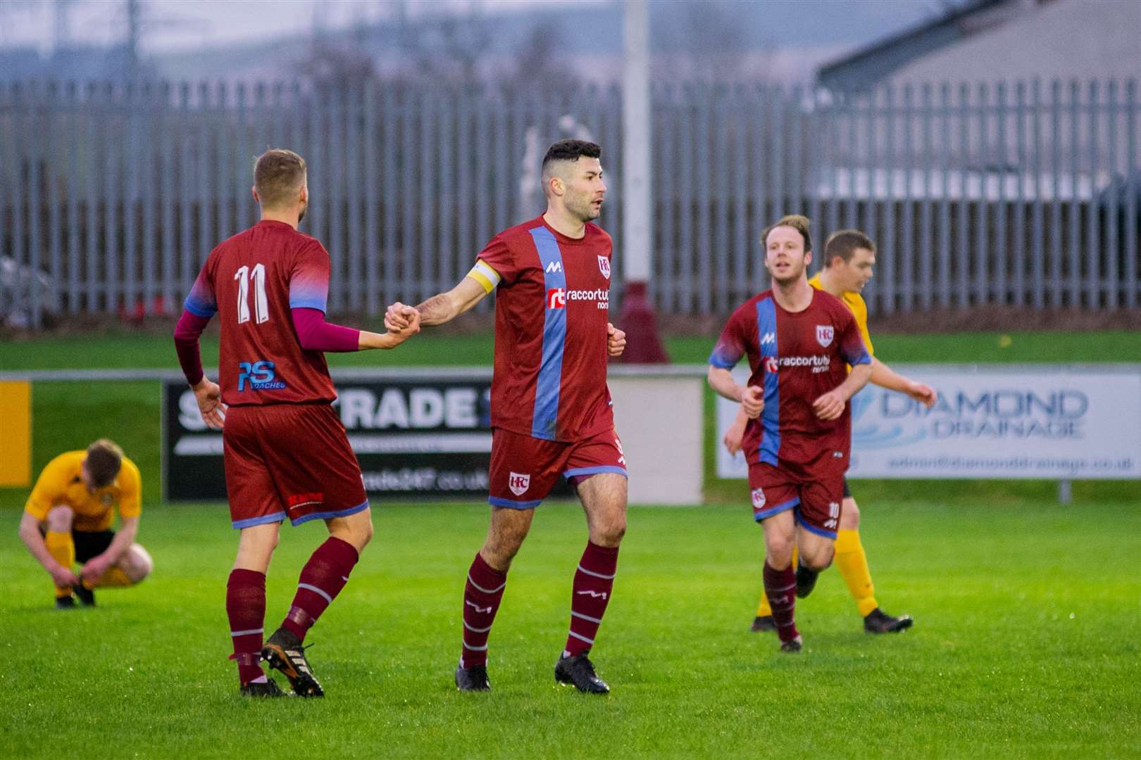 Cammy Keith is congratulated by his Keith team mate James Brownie after scoring his second goal of the afternoon...Keith FC (5) vs Fort William (1) - Scottish Cup Second Preliminary Round - Kyncoh Park, Keith 12/12/2020...Picture: Daniel Forsyth..