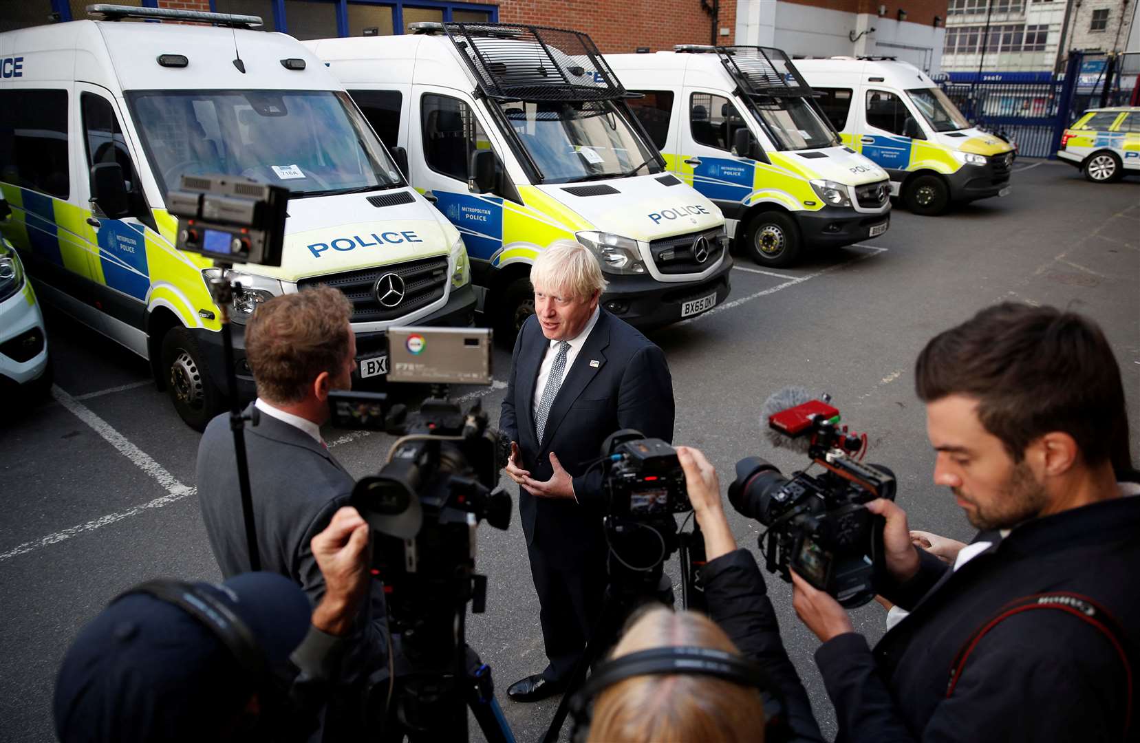 Mr Johnson speaks to the media at a police station in south east London (Peter Nicholls/PA)