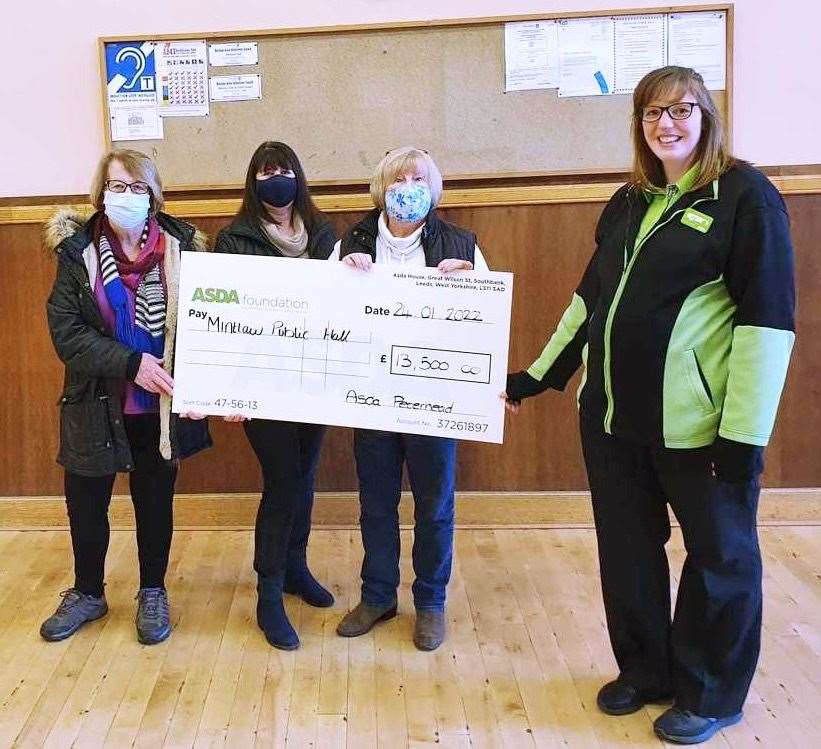 Representatives from Mintlaw Public Hall collected the donation from community champion Zoe.