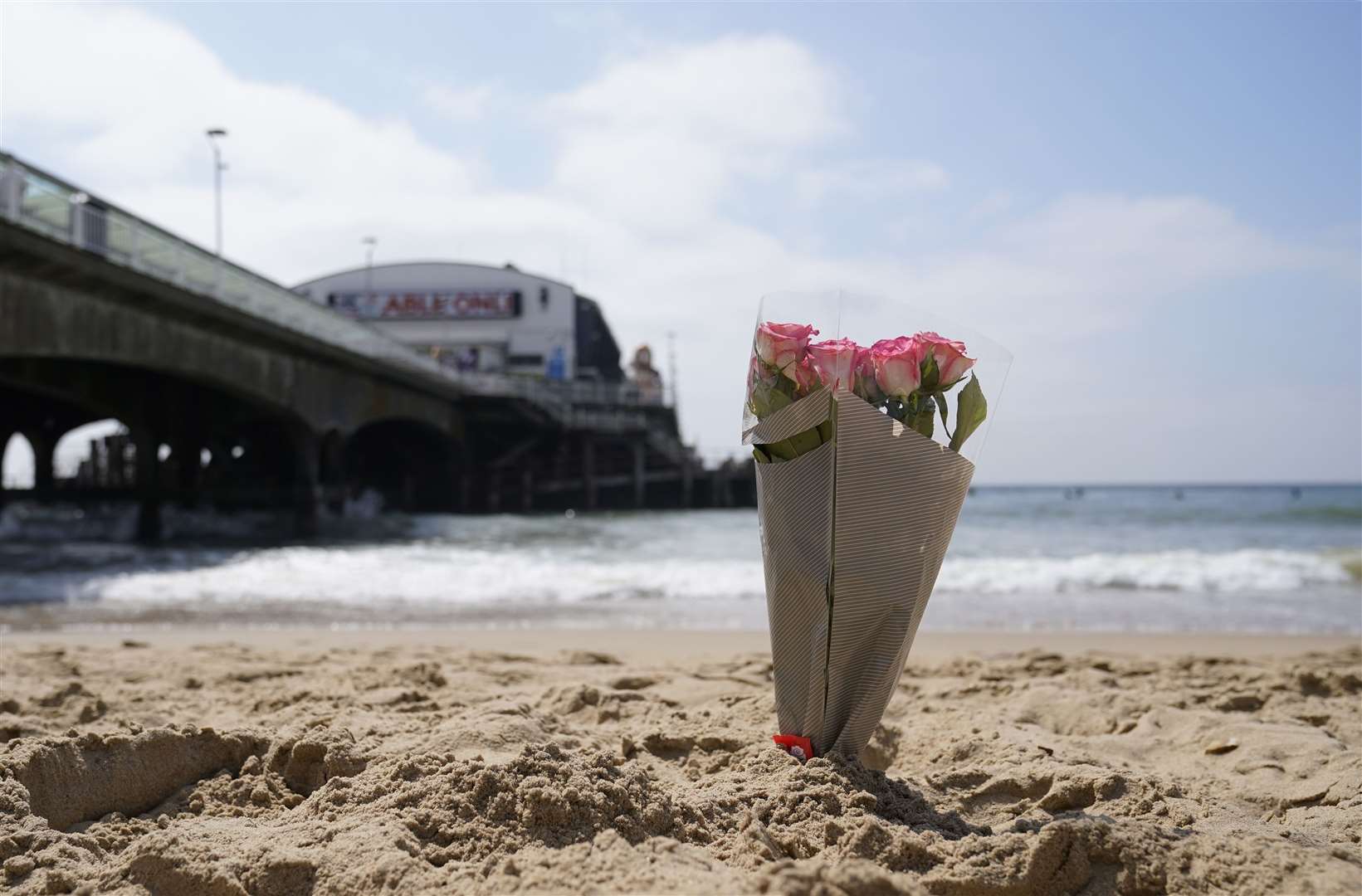 Flowers were left on Bournemouth beach (Andrew Matthews/PA)