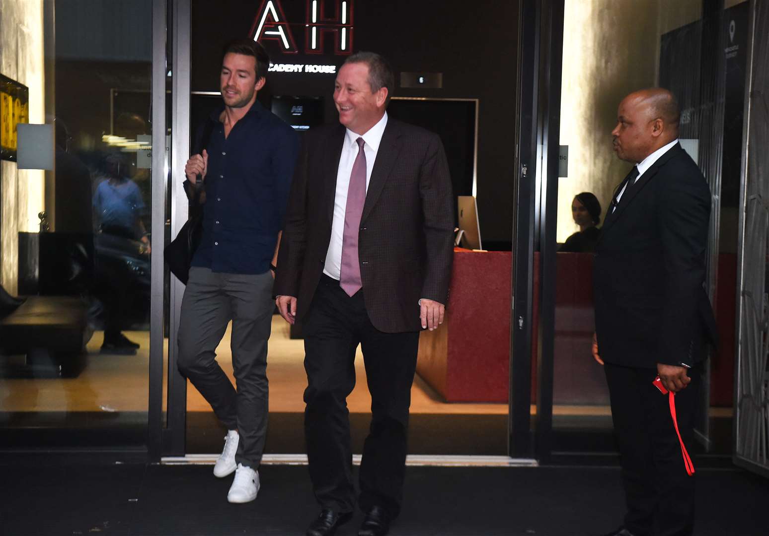 Sports Direct chief Mike Ashley leaves Sports Direct headquarters in 2019 with Michael Murray (left), who is set to replace him in the top job (Kirsty O’Connor/PA)