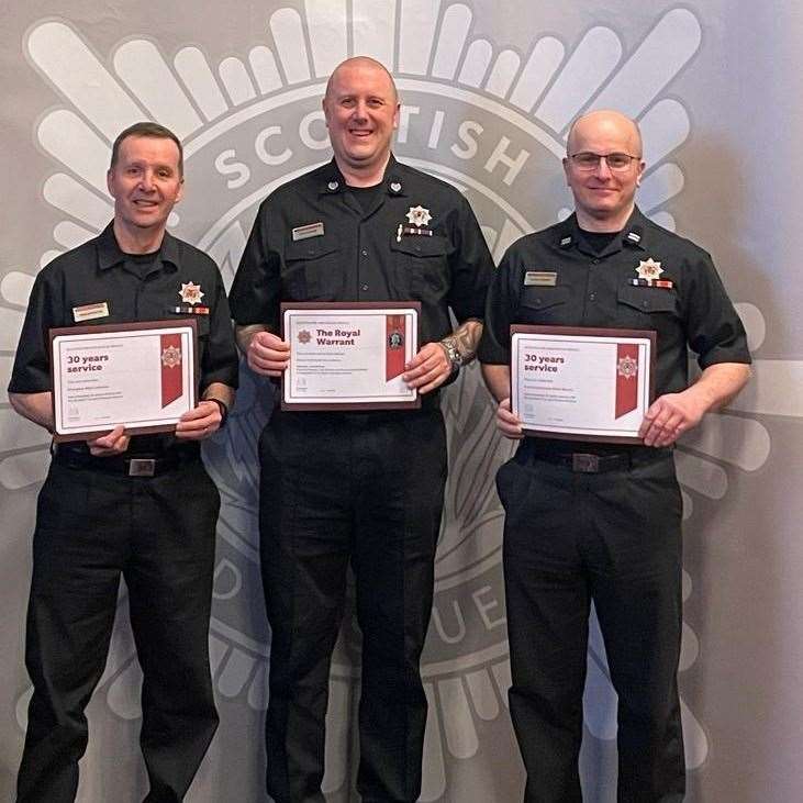 (From left) Firefighter Mark Johnston, Group Commander David Hendry and Crew Commander Atholl Murray proudly show off their awards. Picture: SFRS