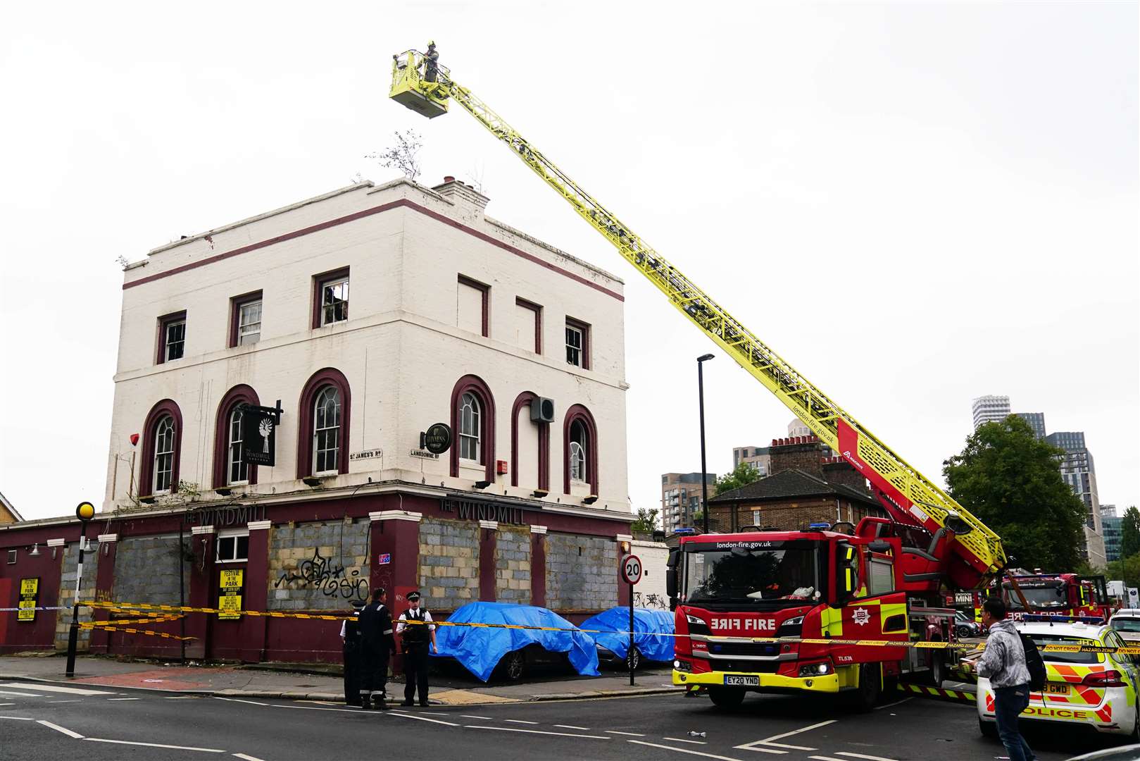 Emergency services attend a fire at the former Windmill pub in St James’s Road in Croydon (Victoria Jones/PA)