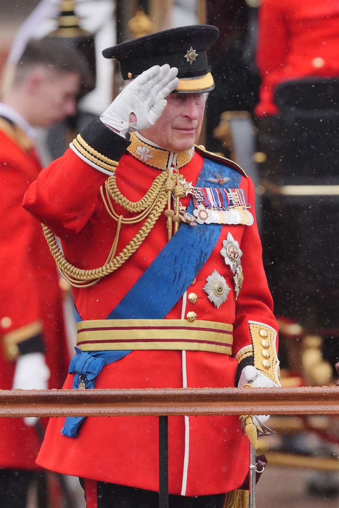 King Charles III salutes outside Buckingham Palace after the Trooping the Colour ceremony (Jonathan Brady/PA)