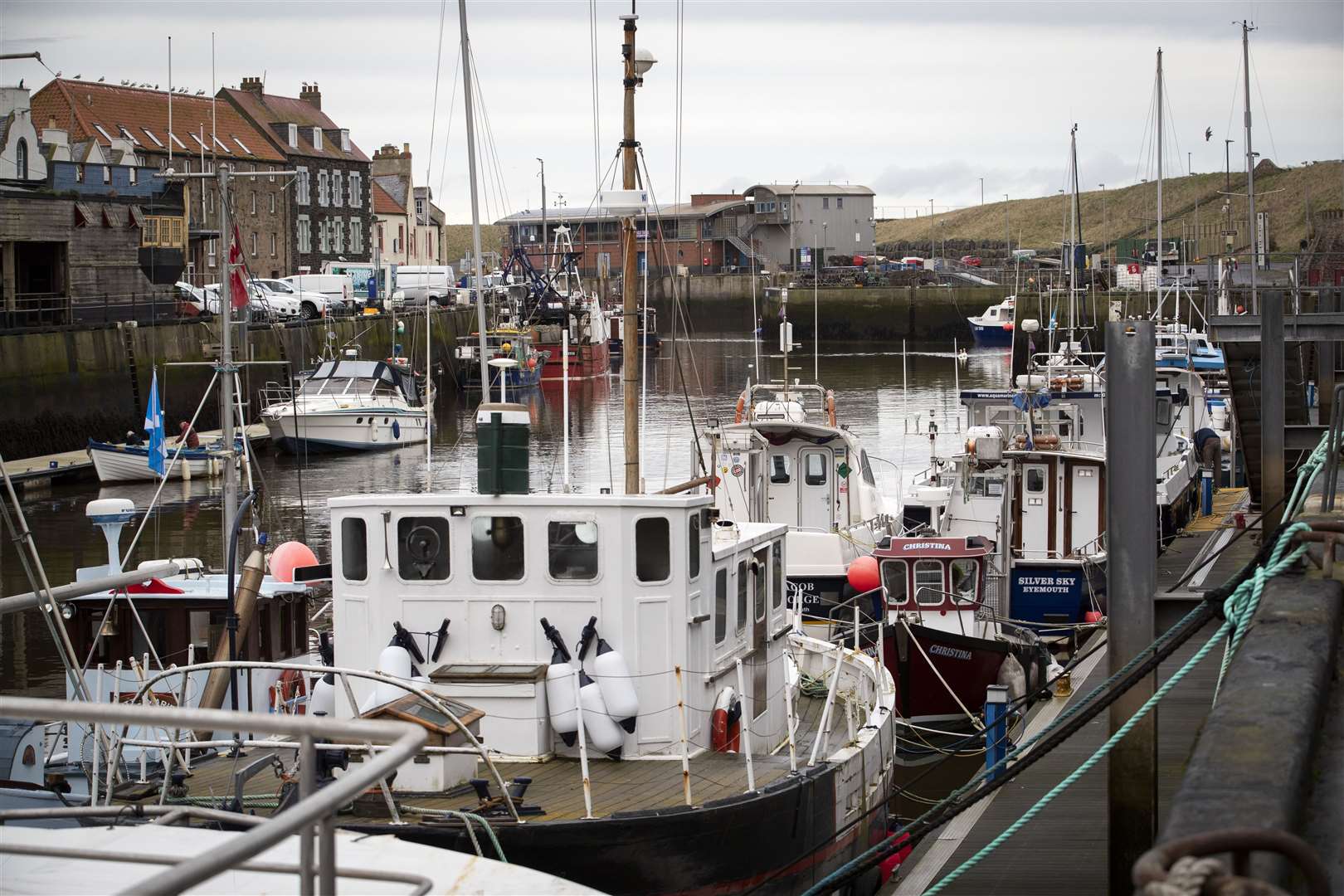 Fishing boats moored in Eyemouth Harbour, Scottish Borders (Jane Barlow/PA)