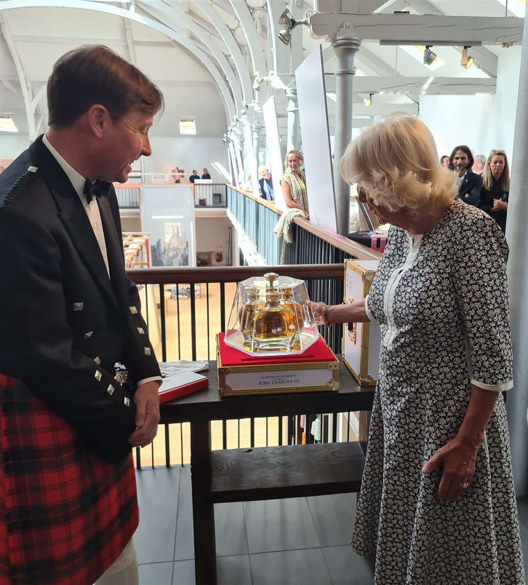 HM Queen Camilla accepting the coronation set from Duncan Taylor Scotch Whisky.