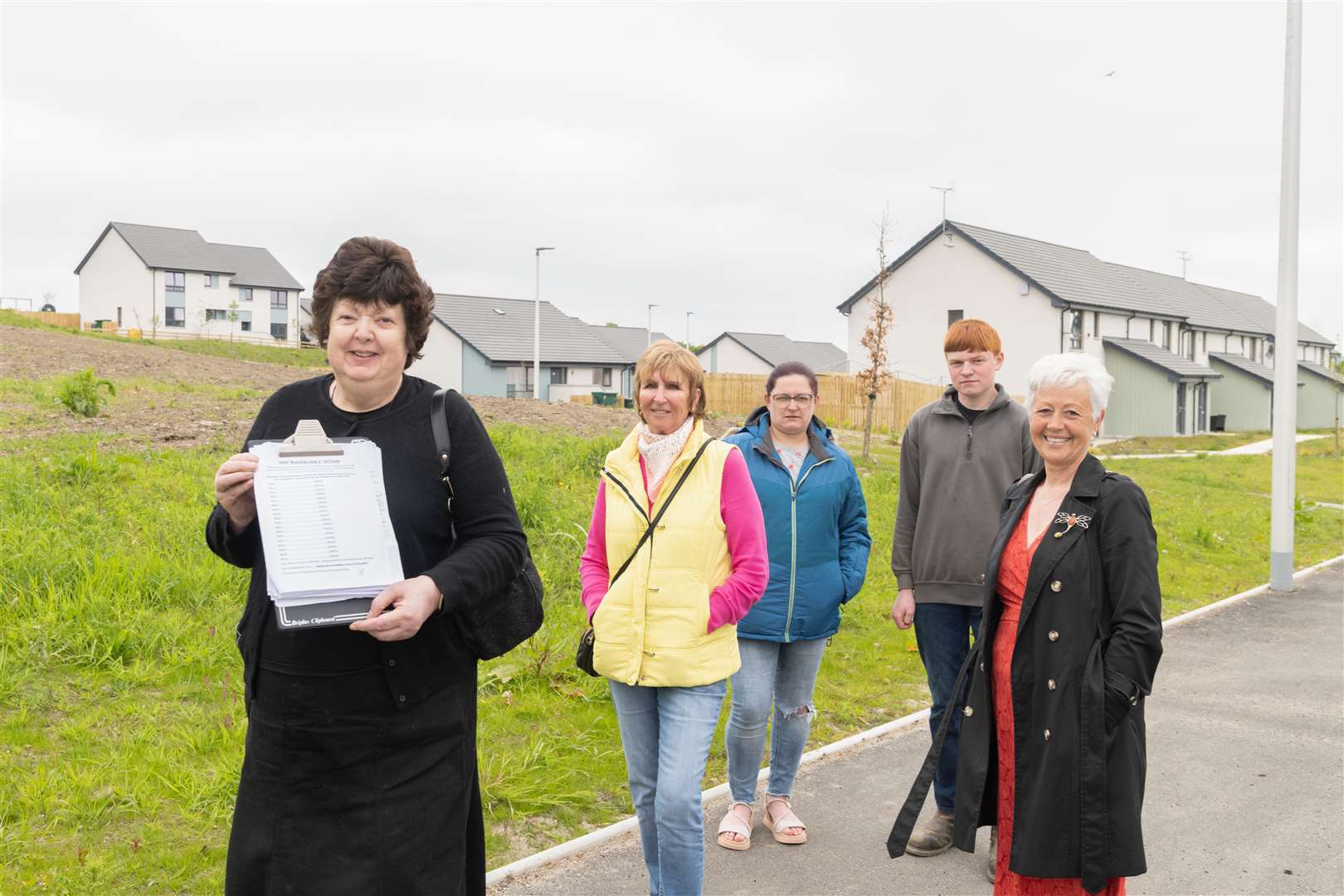From right: Dawn Borland, Alistair McKillop, Geraldine McKillop and Julie Flett with Linda Gorn with her petition to resite the planned Blackhillock II substation...Picture: Beth Taylor.