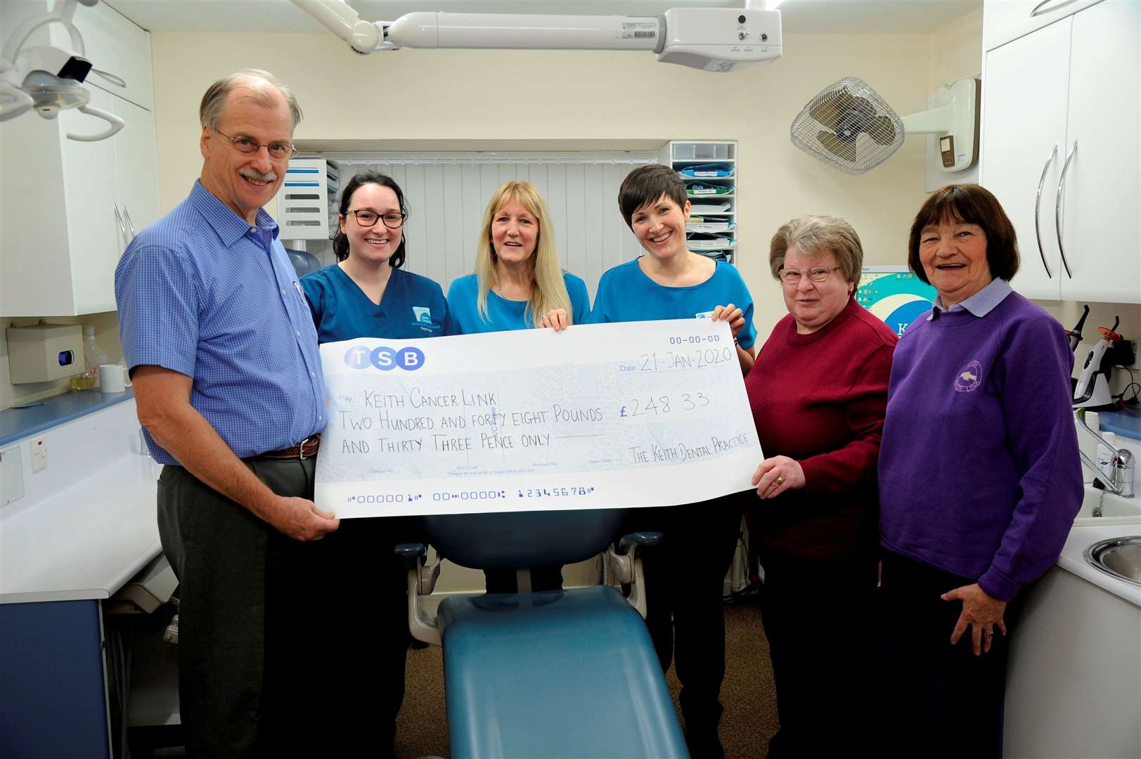 Pictured from left: Principal dentist Theodor Hansen, senior dental nurse Faye Law, receptionist Mo MacDougall, practice manager Erin Jellis. The cheque for £248.33 is being presented to Keith Cancer Link members Ann Cameron and Isobell Sadowski.