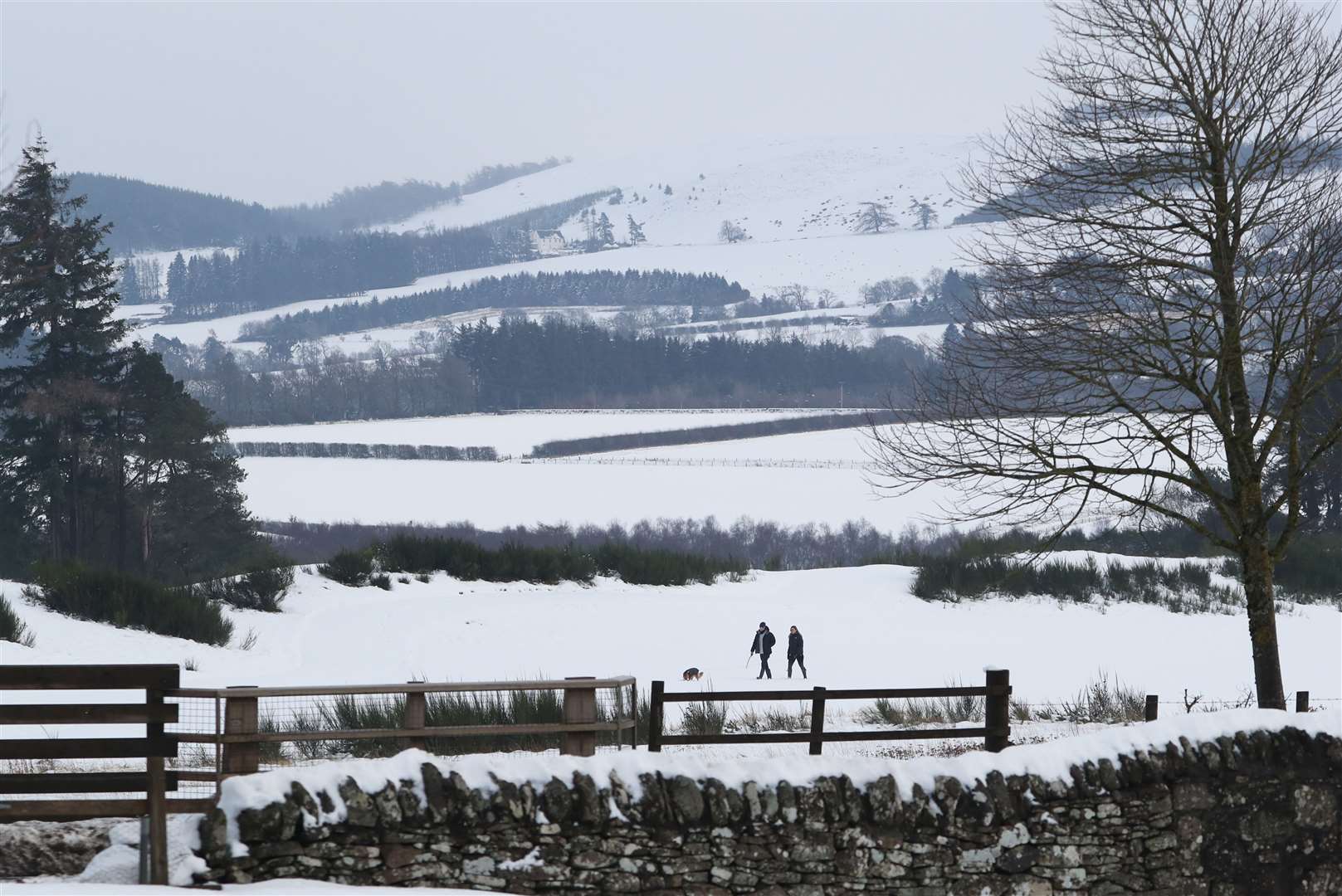 People walk in the snow at Gleneagles in Auchterarder (Andrew Milligan/PA)