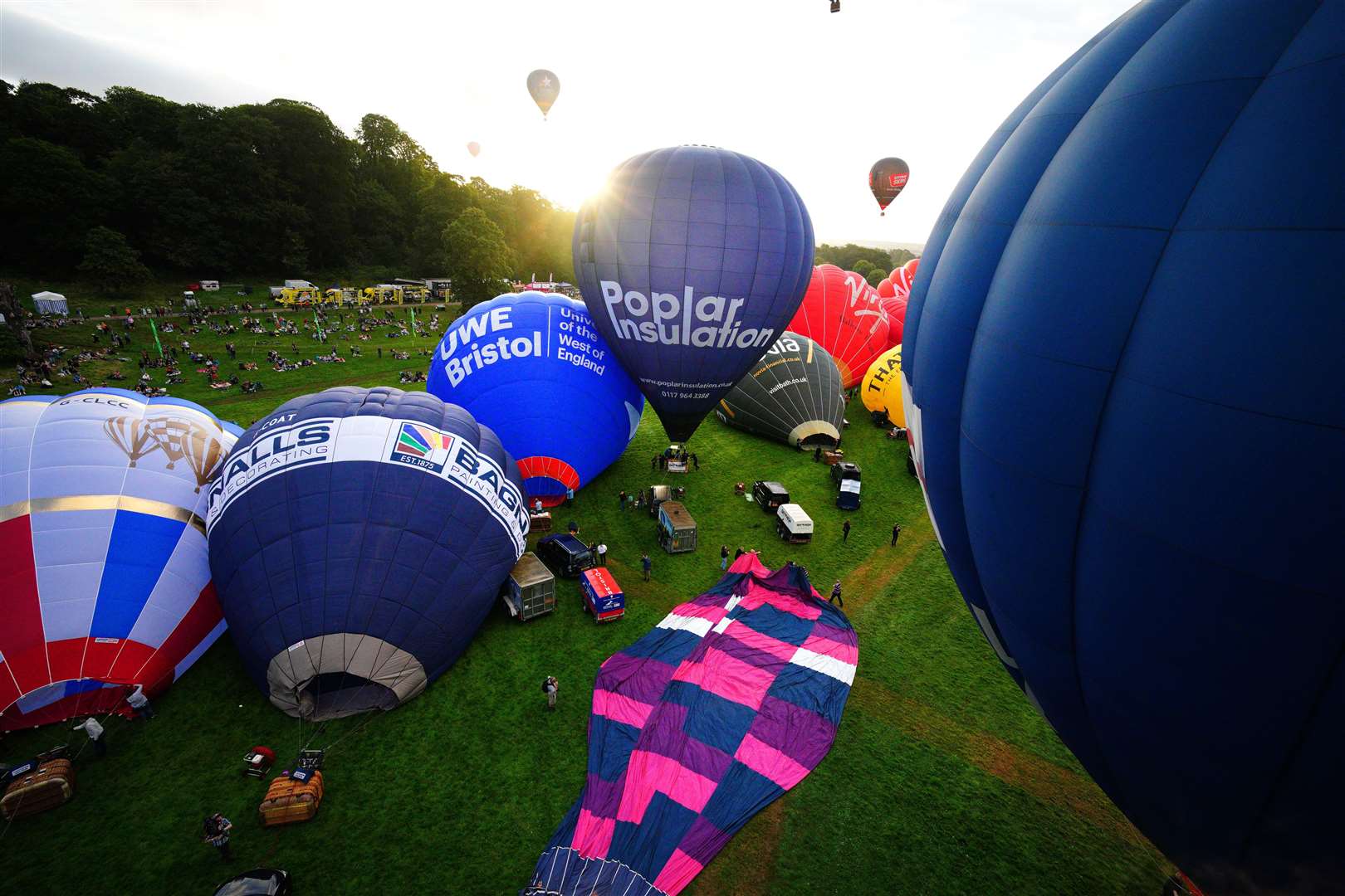 Hot air balloons are inflated during the mass ascent at the Bristol International Balloon Fiesta 2023. Picture date: Friday August 11, 2023.