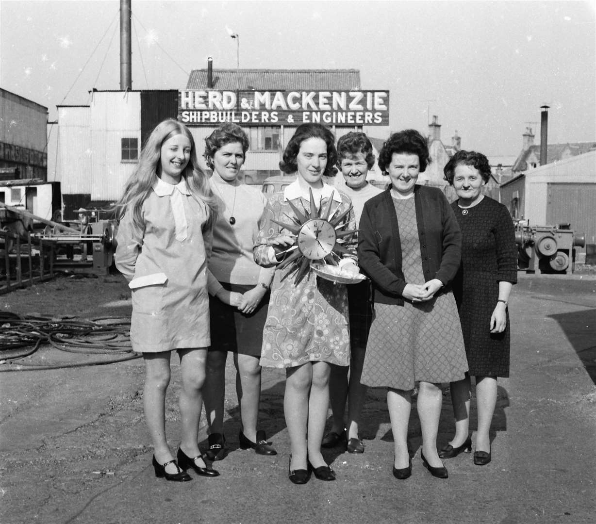 Jean McPherson receives a gift from work colleagues on the occasion of her forthcoming marriage in 1972.