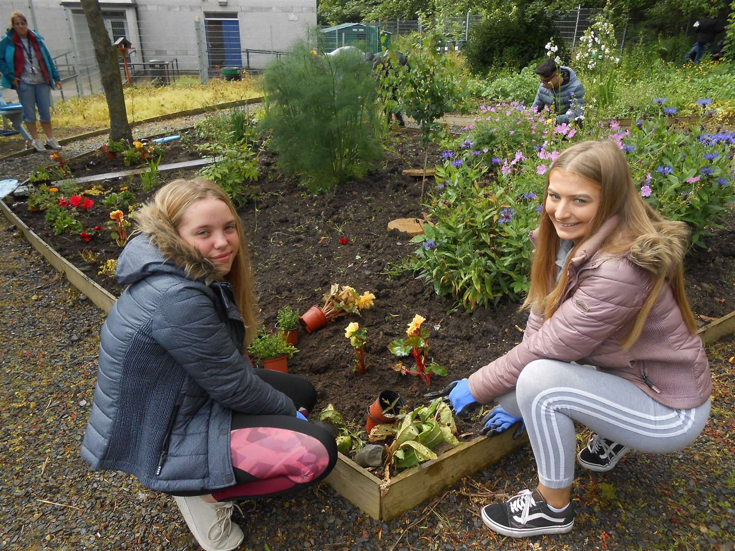 Mintlaw Academy pupils tend to its garden.