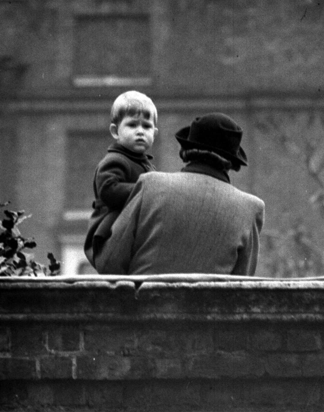 The young Prince Charles with his nanny at Clarence House during the State Opening of Parliament in 1948 (PA)