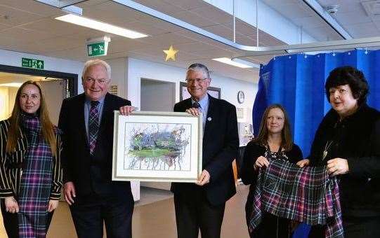 Linda Gorn (right). Also in the photo are Mr Keith Buchan, the heart consultant, plus Andrew Simpson, the Lord Lieutenant of Banffshire, who also once had open heart surgery at ARI.